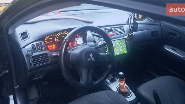 Чорний Міцубісі Lancer, об'ємом двигуна 1.6 л та пробігом 234 тис. км за 3900 $, фото 4 на Automoto.ua