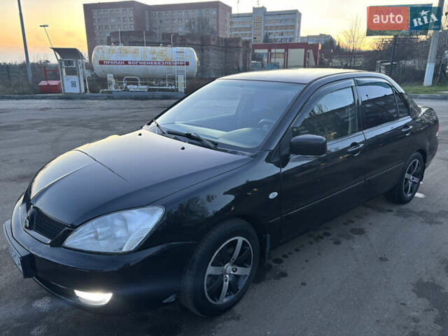 Черный Мицубиси Лансер, объемом двигателя 1.6 л и пробегом 315 тыс. км за 4000 $, фото 3 на Automoto.ua