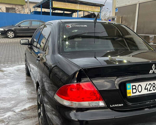 Черный Мицубиси Лансер, объемом двигателя 1.6 л и пробегом 180 тыс. км за 3499 $, фото 5 на Automoto.ua