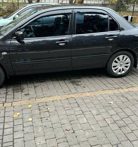 Чорний Міцубісі Lancer, об'ємом двигуна 1.59 л та пробігом 300 тис. км за 3400 $, фото 2 на Automoto.ua