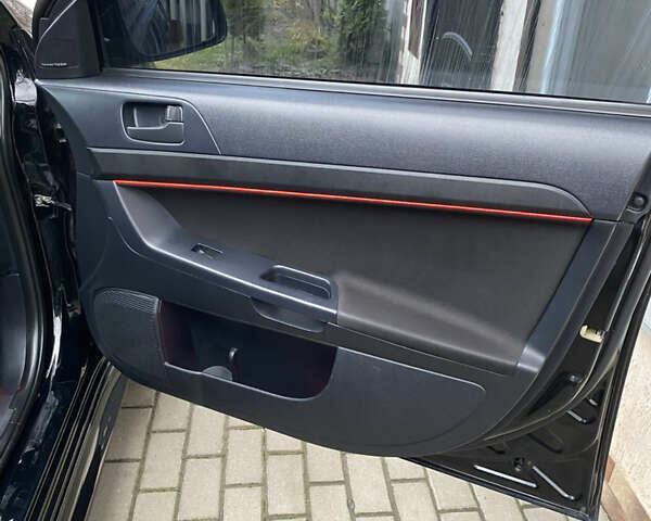 Черный Мицубиси Лансер, объемом двигателя 2 л и пробегом 164 тыс. км за 8300 $, фото 21 на Automoto.ua