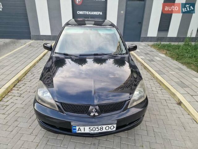 Чорний Міцубісі Lancer, об'ємом двигуна 2 л та пробігом 272 тис. км за 4750 $, фото 4 на Automoto.ua