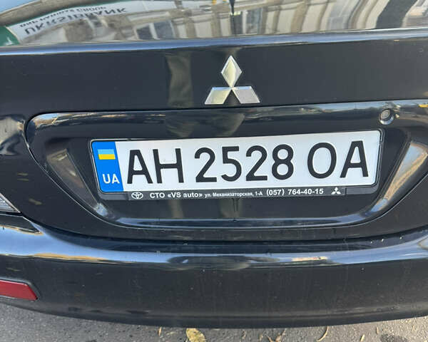 Чорний Міцубісі Lancer, об'ємом двигуна 1.58 л та пробігом 243 тис. км за 3800 $, фото 9 на Automoto.ua