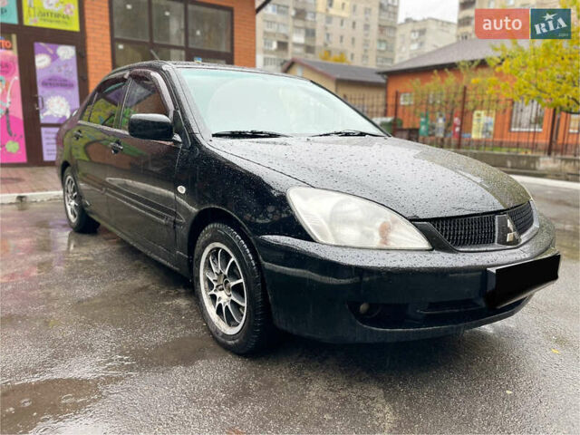 Черный Мицубиси Лансер, объемом двигателя 1.58 л и пробегом 265 тыс. км за 3550 $, фото 11 на Automoto.ua