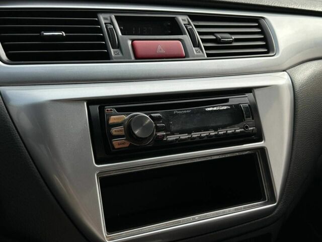 Мицубиси Лансер 2007 в Кривом Роге на Automoto.ua Черный Мицубиси Лансер, объемом двигателя 2 л и пробегом 143 тыс. км за 5400 $, фото 9 на Automoto.ua