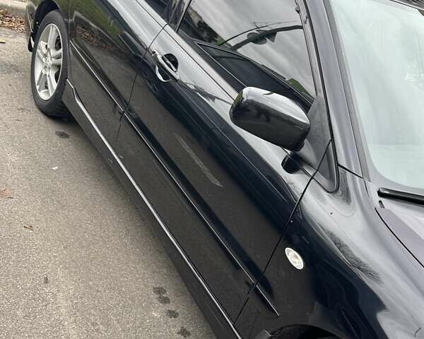 Черный Мицубиси Лансер, объемом двигателя 2 л и пробегом 219 тыс. км за 4400 $, фото 2 на Automoto.ua