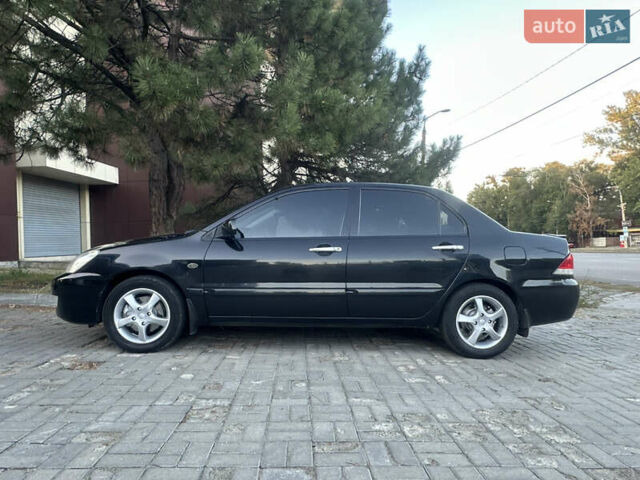 Черный Мицубиси Лансер, объемом двигателя 1.59 л и пробегом 269 тыс. км за 4999 $, фото 6 на Automoto.ua