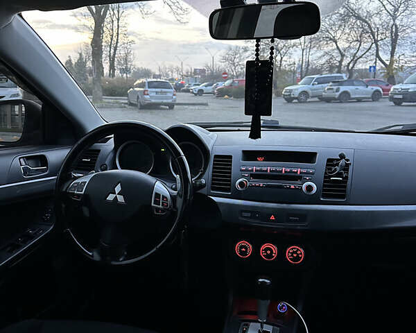 Черный Мицубиси Лансер, объемом двигателя 2 л и пробегом 245 тыс. км за 6200 $, фото 14 на Automoto.ua