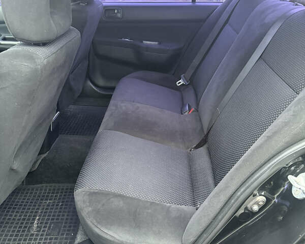 Чорний Міцубісі Lancer, об'ємом двигуна 1.58 л та пробігом 256 тис. км за 3700 $, фото 16 на Automoto.ua