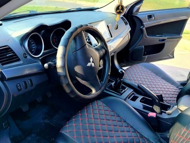 Черный Мицубиси Лансер, объемом двигателя 1.5 л и пробегом 215 тыс. км за 5600 $, фото 6 на Automoto.ua