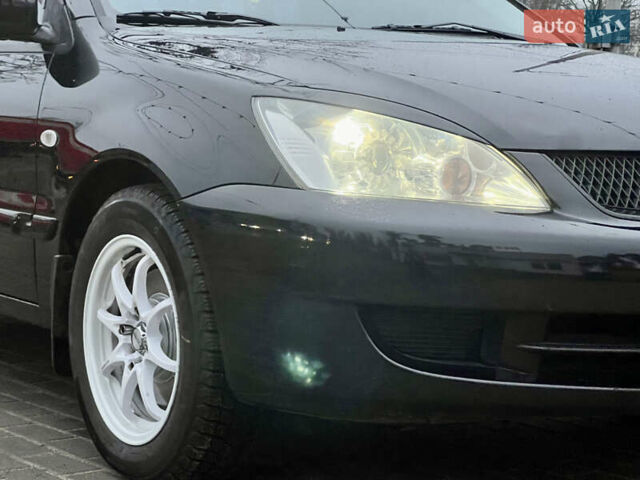 Чорний Міцубісі Lancer, об'ємом двигуна 1.6 л та пробігом 303 тис. км за 4350 $, фото 13 на Automoto.ua