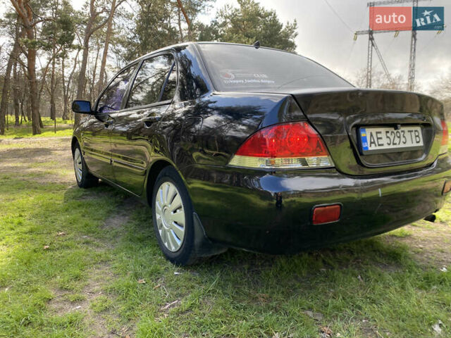 Чорний Міцубісі Lancer, об'ємом двигуна 1.6 л та пробігом 224 тис. км за 4950 $, фото 9 на Automoto.ua