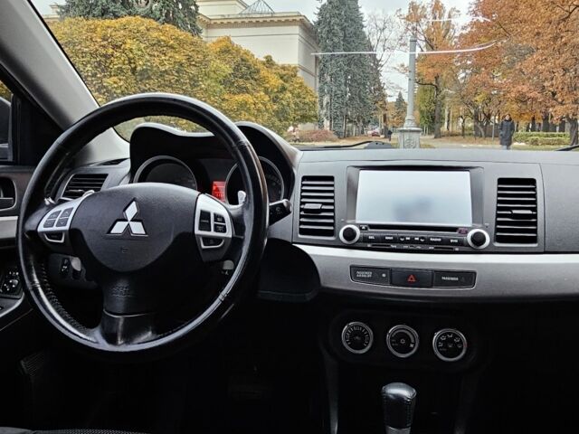 Черный Мицубиси Лансер, объемом двигателя 2 л и пробегом 115 тыс. км за 5000 $, фото 16 на Automoto.ua