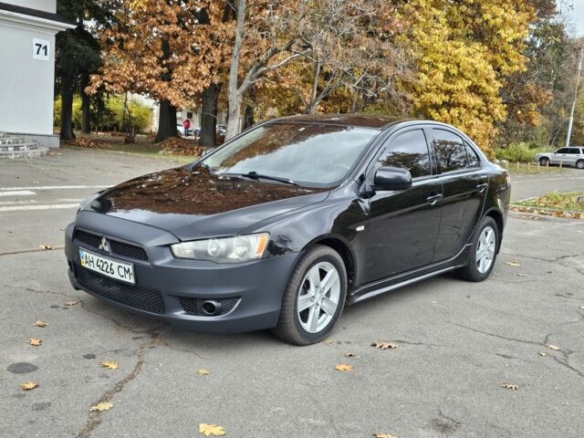 Черный Мицубиси Лансер, объемом двигателя 2 л и пробегом 115 тыс. км за 5000 $, фото 1 на Automoto.ua