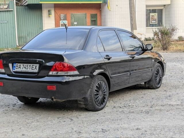 Черный Мицубиси Лансер, объемом двигателя 1.6 л и пробегом 226 тыс. км за 4800 $, фото 3 на Automoto.ua