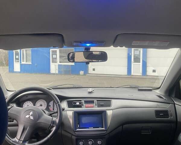 Черный Мицубиси Лансер, объемом двигателя 1.58 л и пробегом 263 тыс. км за 4000 $, фото 1 на Automoto.ua