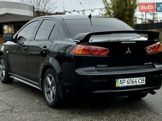 Черный Мицубиси Лансер, объемом двигателя 2 л и пробегом 215 тыс. км за 5500 $, фото 9 на Automoto.ua
