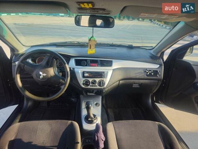 Чорний Міцубісі Lancer, об'ємом двигуна 1.59 л та пробігом 180 тис. км за 4999 $, фото 15 на Automoto.ua