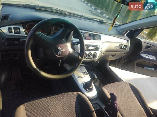 Чорний Міцубісі Lancer, об'ємом двигуна 1.59 л та пробігом 180 тис. км за 4999 $, фото 16 на Automoto.ua