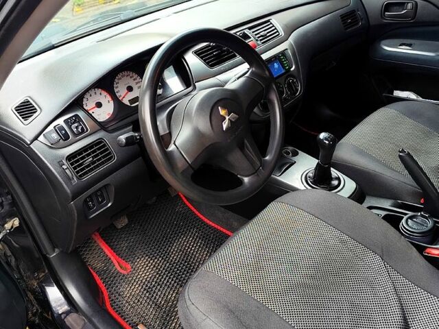 Черный Мицубиси Лансер, объемом двигателя 1.6 л и пробегом 171 тыс. км за 4350 $, фото 7 на Automoto.ua