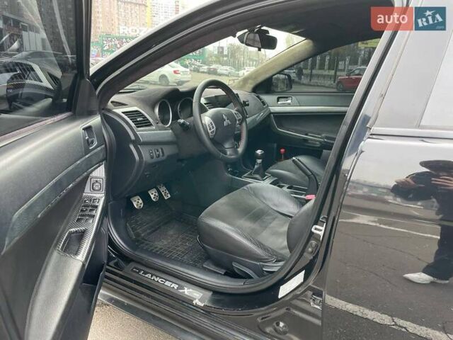 Черный Мицубиси Лансер, объемом двигателя 2 л и пробегом 246 тыс. км за 7500 $, фото 12 на Automoto.ua