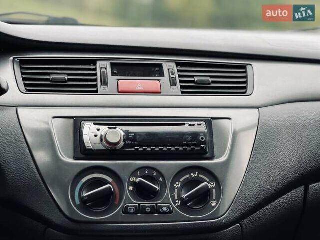 Чорний Міцубісі Lancer, об'ємом двигуна 1.6 л та пробігом 243 тис. км за 4950 $, фото 50 на Automoto.ua