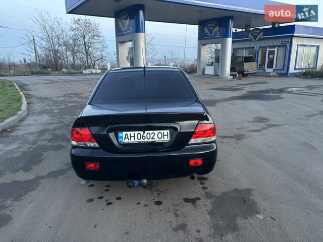 Черный Мицубиси Лансер, объемом двигателя 1.6 л и пробегом 315 тыс. км за 4000 $, фото 5 на Automoto.ua