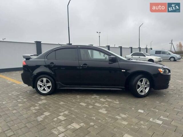 Черный Мицубиси Лансер, объемом двигателя 2 л и пробегом 259 тыс. км за 6500 $, фото 6 на Automoto.ua