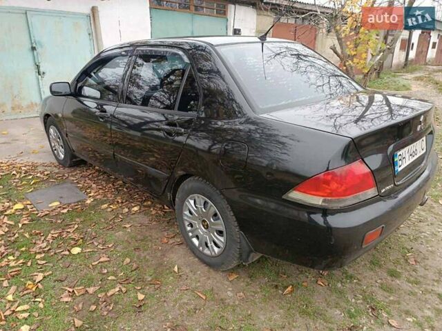 Чорний Міцубісі Lancer, об'ємом двигуна 1.58 л та пробігом 227 тис. км за 4100 $, фото 7 на Automoto.ua