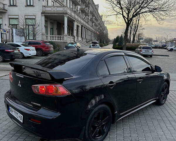 Черный Мицубиси Лансер, объемом двигателя 2 л и пробегом 245 тыс. км за 6200 $, фото 10 на Automoto.ua
