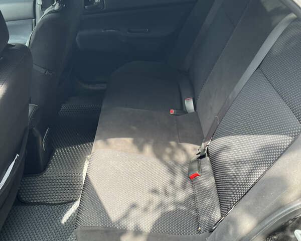 Чорний Міцубісі Lancer, об'ємом двигуна 1.59 л та пробігом 150 тис. км за 5500 $, фото 11 на Automoto.ua