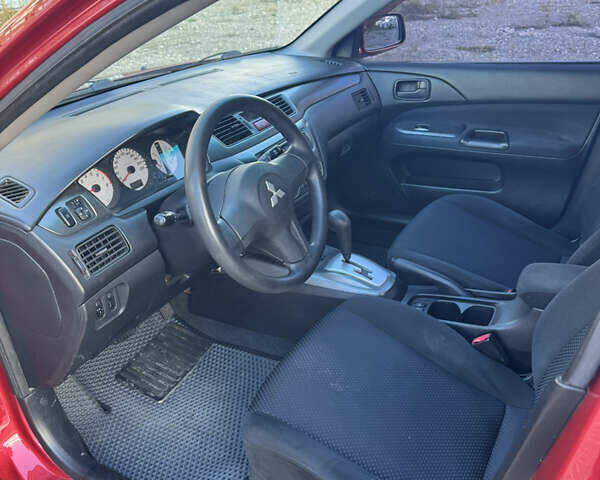 Чорний Міцубісі Lancer, об'ємом двигуна 1.6 л та пробігом 195 тис. км за 5000 $, фото 5 на Automoto.ua