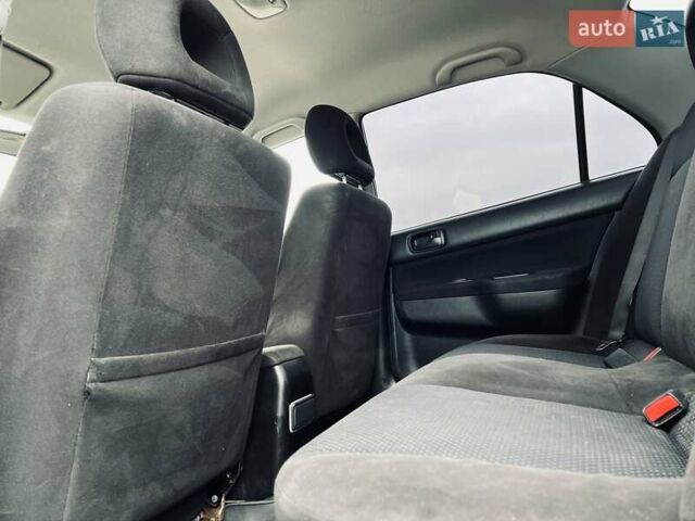 Чорний Міцубісі Lancer, об'ємом двигуна 1.6 л та пробігом 243 тис. км за 4950 $, фото 33 на Automoto.ua