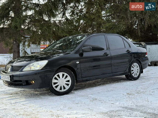 Чорний Міцубісі Lancer, об'ємом двигуна 1.6 л та пробігом 190 тис. км за 3450 $, фото 1 на Automoto.ua
