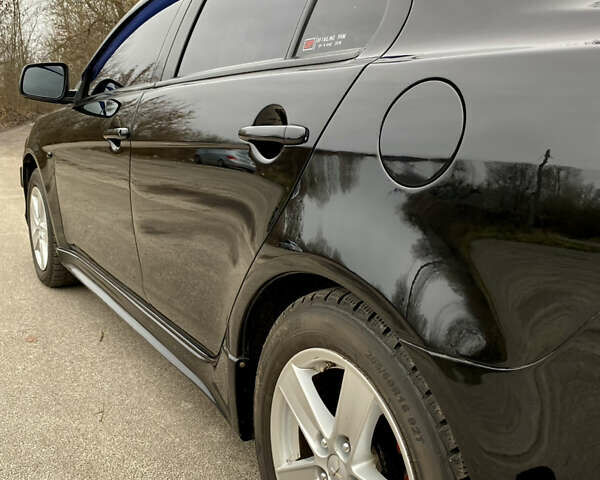 Черный Мицубиси Лансер, объемом двигателя 2 л и пробегом 164 тыс. км за 8300 $, фото 9 на Automoto.ua