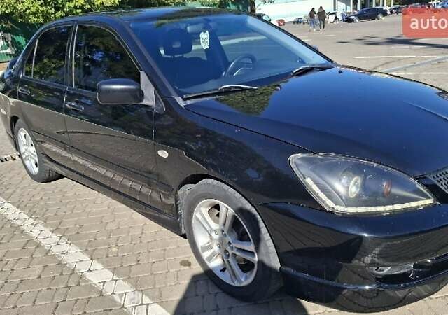 Чорний Міцубісі Lancer, об'ємом двигуна 2 л та пробігом 174 тис. км за 4800 $, фото 3 на Automoto.ua