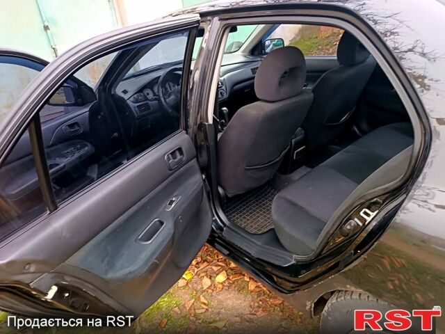 Чорний Міцубісі Lancer, об'ємом двигуна 1.6 л та пробігом 227 тис. км за 4100 $, фото 9 на Automoto.ua