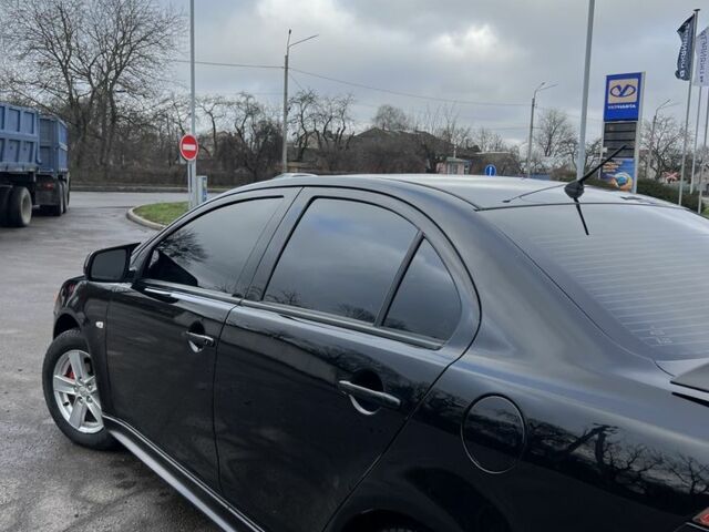 Черный Мицубиси Лансер, объемом двигателя 2 л и пробегом 350 тыс. км за 6700 $, фото 5 на Automoto.ua