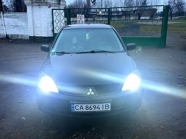 Чорний Міцубісі Lancer, об'ємом двигуна 1.6 л та пробігом 201 тис. км за 4000 $, фото 1 на Automoto.ua