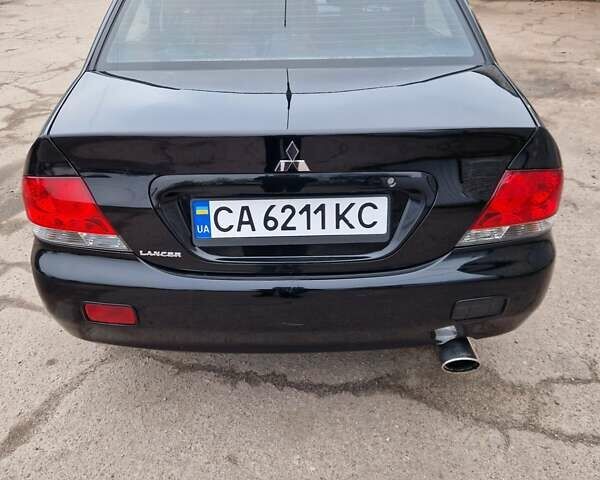 Чорний Міцубісі Lancer, об'ємом двигуна 1.6 л та пробігом 273 тис. км за 3999 $, фото 15 на Automoto.ua