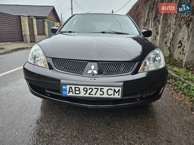 Черный Мицубиси Лансер, объемом двигателя 1.6 л и пробегом 152 тыс. км за 4999 $, фото 5 на Automoto.ua