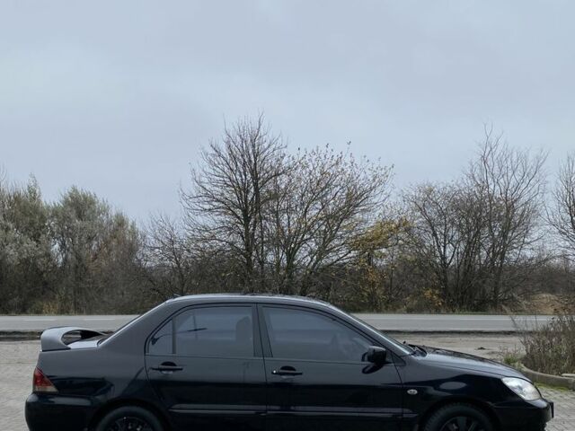 Черный Мицубиси Лансер, объемом двигателя 1.6 л и пробегом 263 тыс. км за 2900 $, фото 7 на Automoto.ua