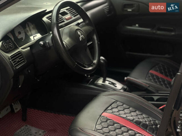 Черный Мицубиси Лансер, объемом двигателя 1.6 л и пробегом 211 тыс. км за 5700 $, фото 27 на Automoto.ua