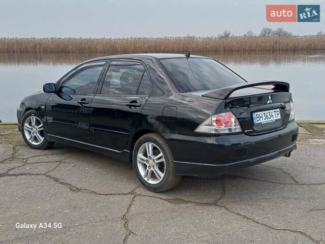 Черный Мицубиси Лансер, объемом двигателя 2 л и пробегом 286 тыс. км за 4000 $, фото 7 на Automoto.ua