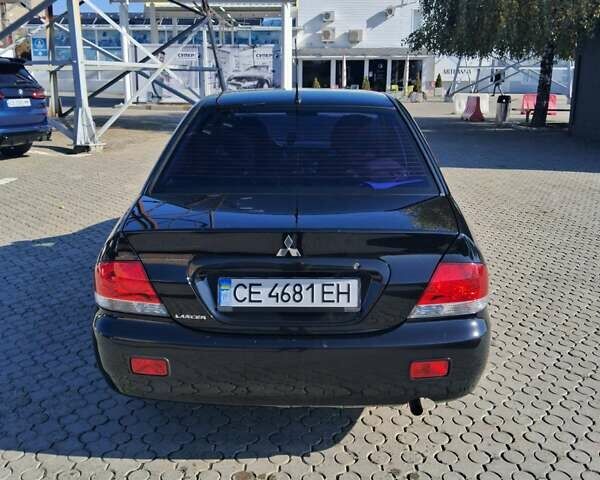 Міцубісі Lancer 2007 у Чернівцях на Automoto.ua Чорний Міцубісі Lancer, об'ємом двигуна 1.58 л та пробігом 247 тис. км за 4300 $, фото 7 на Automoto.ua