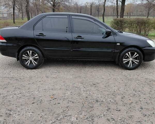 Чорний Міцубісі Lancer, об'ємом двигуна 1.58 л та пробігом 201 тис. км за 4500 $, фото 3 на Automoto.ua