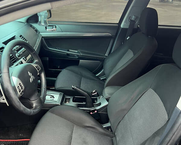 Черный Мицубиси Лансер, объемом двигателя 2 л и пробегом 350 тыс. км за 6700 $, фото 14 на Automoto.ua