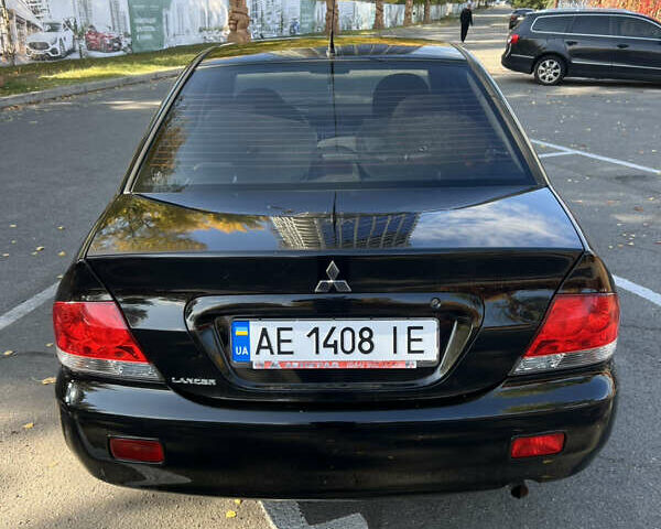 Чорний Міцубісі Lancer, об'ємом двигуна 1.58 л та пробігом 175 тис. км за 5200 $, фото 5 на Automoto.ua