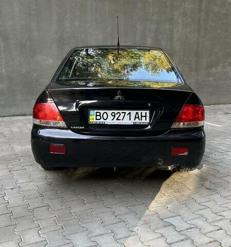 Чорний Міцубісі Lancer, об'ємом двигуна 1.58 л та пробігом 135 тис. км за 4100 $, фото 4 на Automoto.ua