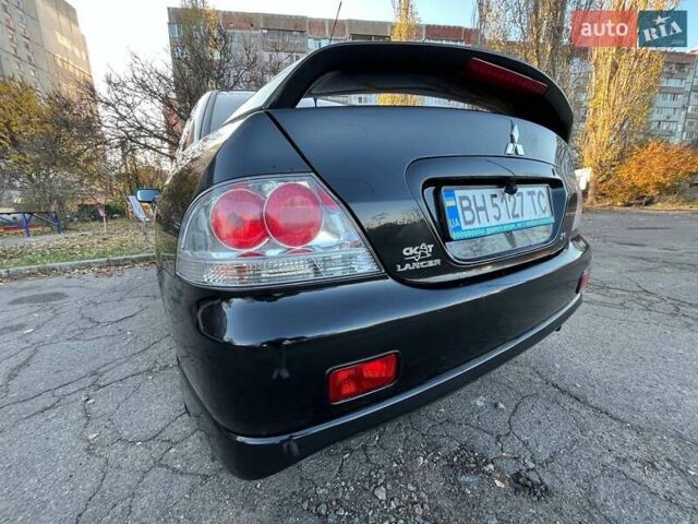 Черный Мицубиси Лансер, объемом двигателя 2 л и пробегом 280 тыс. км за 5400 $, фото 6 на Automoto.ua
